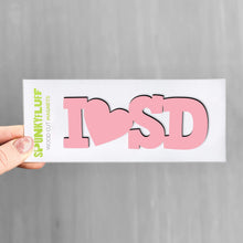 Load image into Gallery viewer, Spunky Fluff Proudly handmade in South Dakota, USA Pink State Initials Tiny Word Magnet
