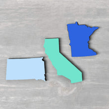 Load image into Gallery viewer, Spunky Fluff Proudly handmade in South Dakota, USA Powder State Shape Pride Magnets
