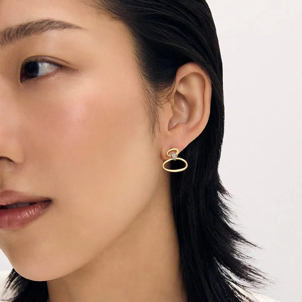 Dean Davidson Celeste Droplet Earring in brushed gold with pavé detail shown on ear