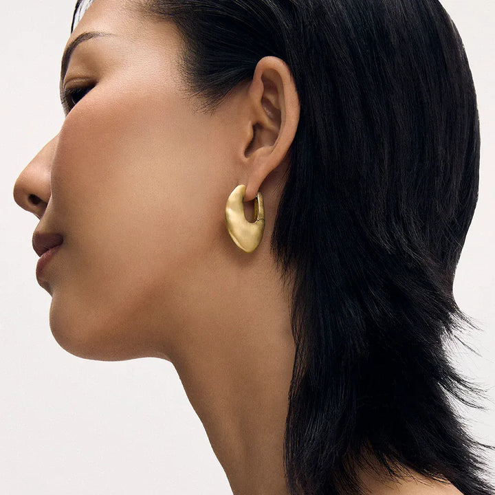 Dean Davidson Serra Hinged Hoops in gold, worn