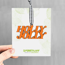 Load image into Gallery viewer, Spunky Fluff Proudly handmade in South Dakota, USA Orange Holly Jolly Stacked Tiny Word Ornament
